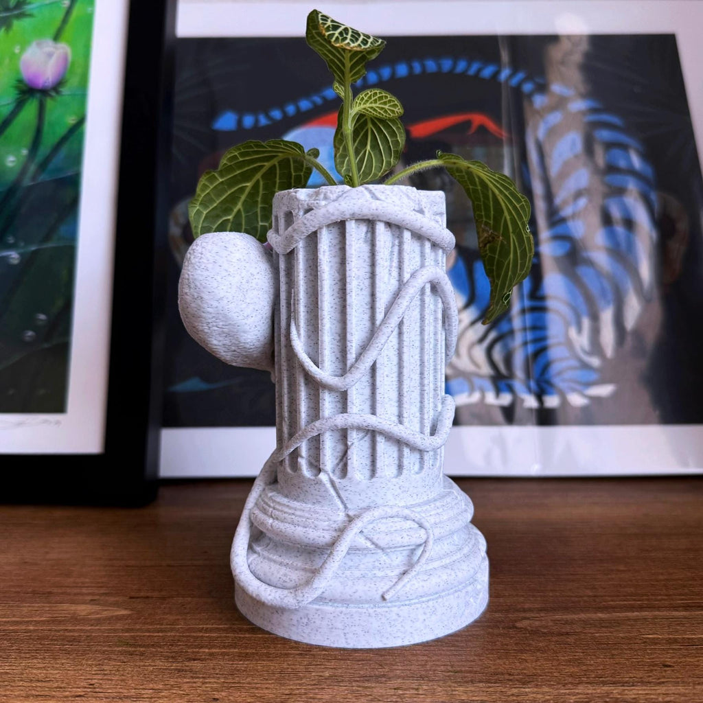 A propagation vase designed to look like a Greek Column with an Octopus wrapped around it