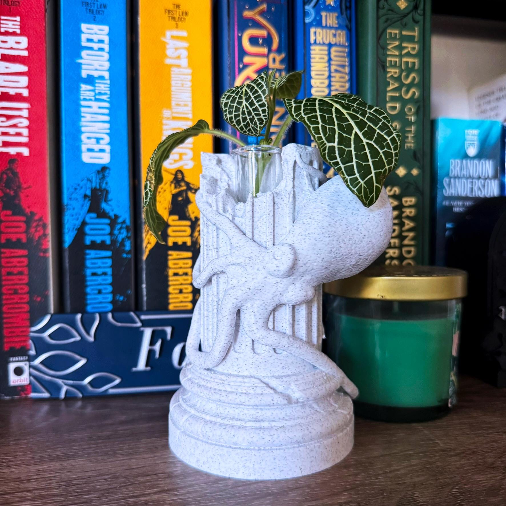 A propagation vase designed to look like a Greek Column with an Octopus wrapped around it