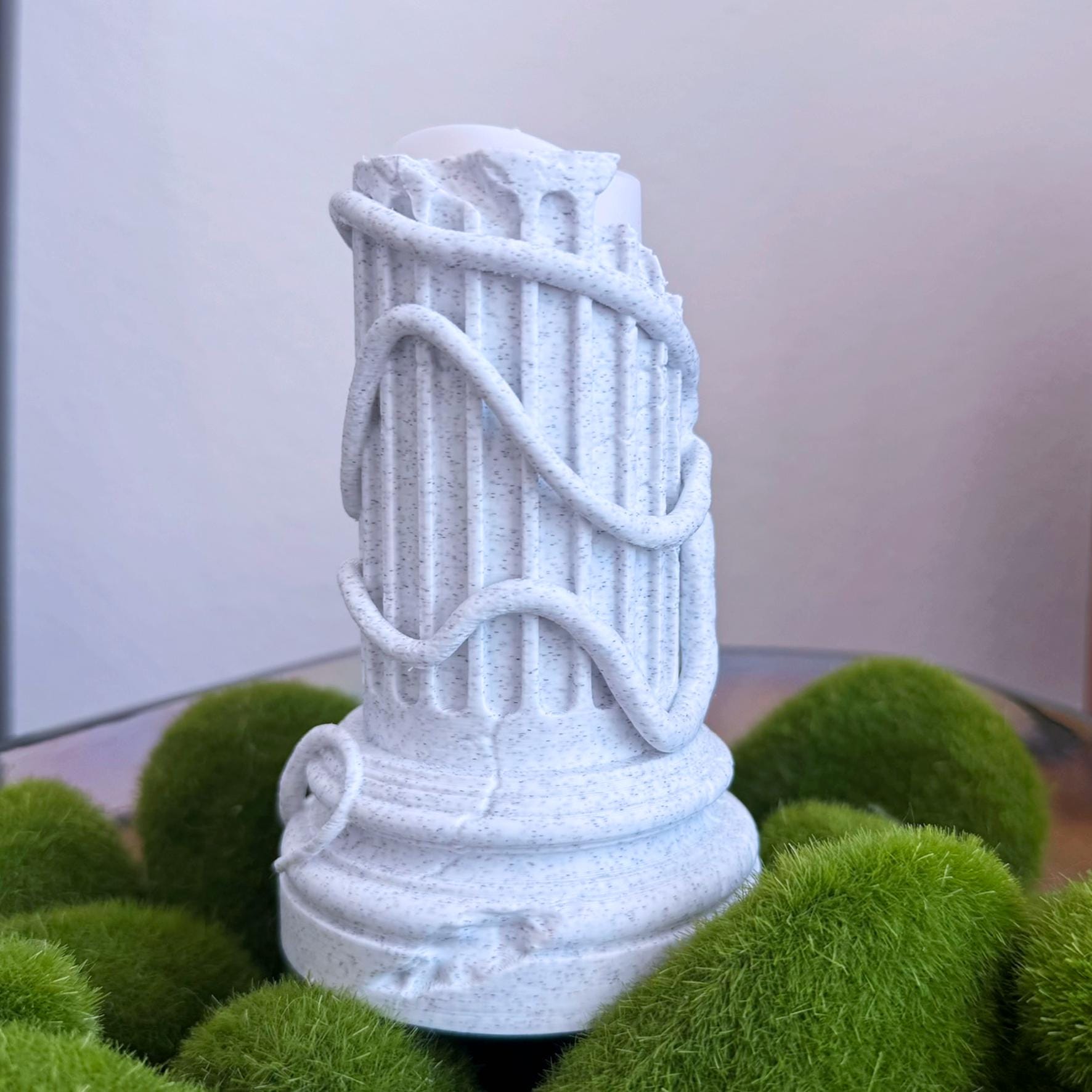 Flameless Sculptural Candle Holder of a Greek Column with an Octopus wrapped around it.