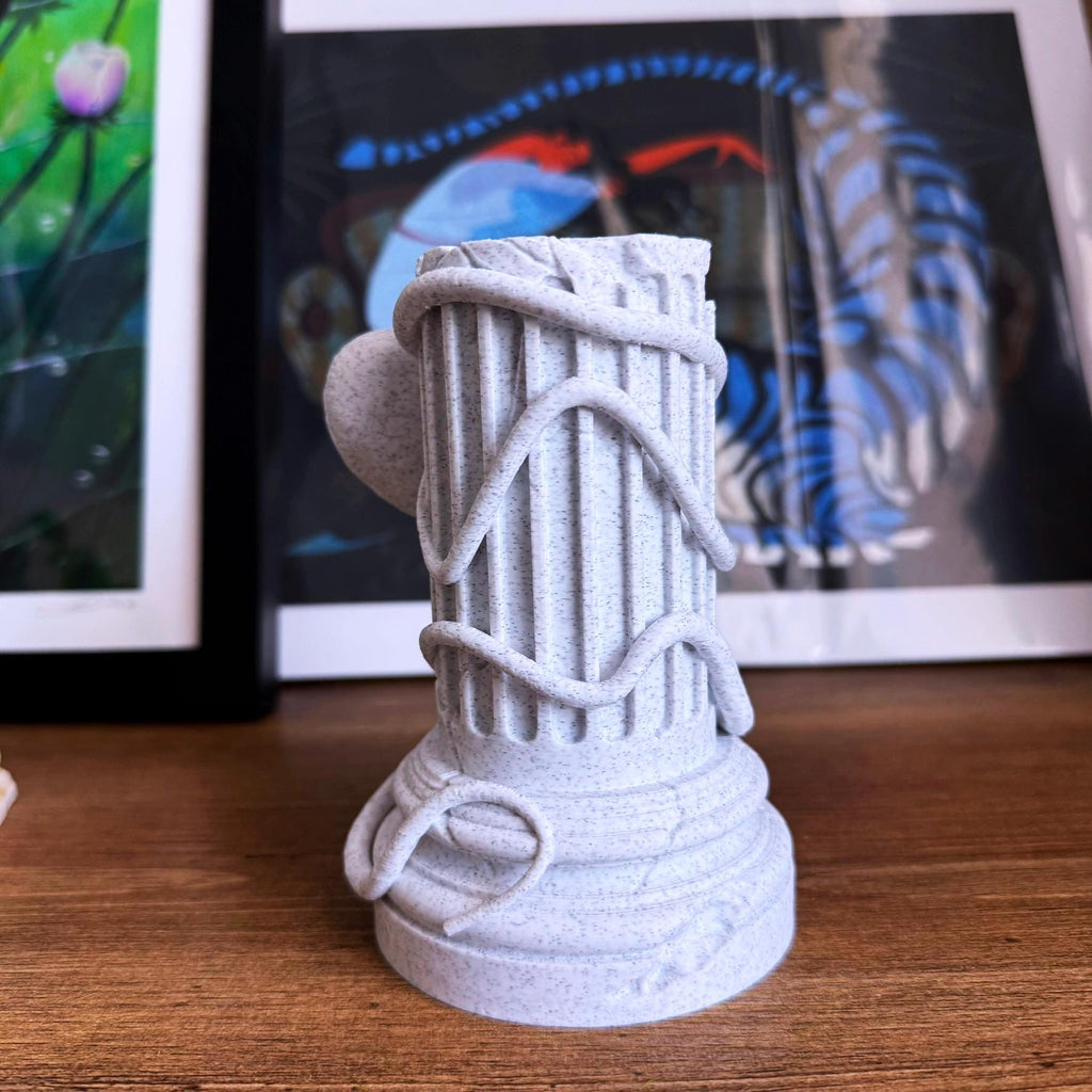 A propagation vase designed to look like a Greek Column with an Octopus wrapped around it