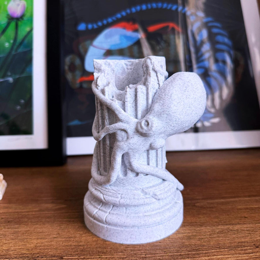 A propagation vase designed to look like a Greek Column with an Octopus wrapped around it