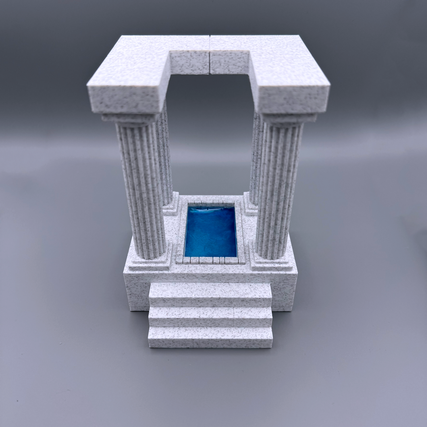 These 3d printed marble bookends are in the form of an ancient temple, with a pool at the center. These stately bookends elevate any bookshelf and add a classical flair. For lovers of antient architecture of Grece and Rome