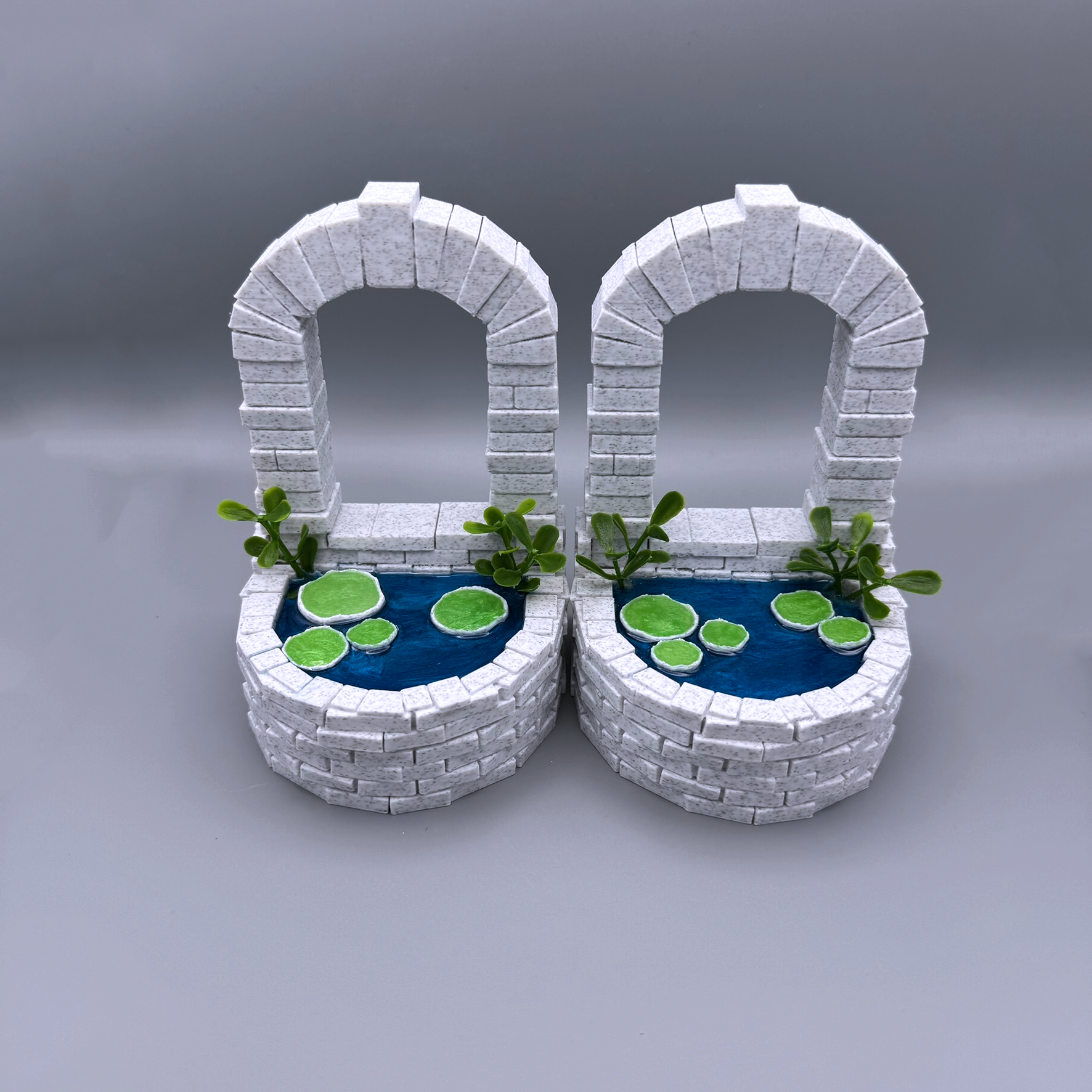 magical well pond bookend, 3d printed brick pond well with marble texture and resin water, lily pads and pond grass bookend. Cute, cool, unique bookend