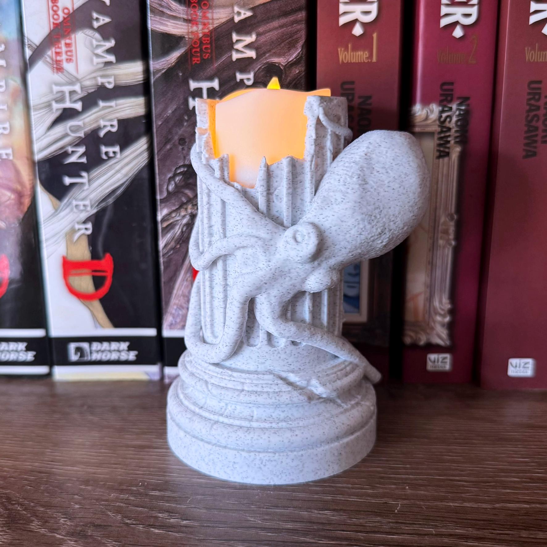 Flameless Sculptural Candle Holder of a Greek Column with an Octopus wrapped around it.
