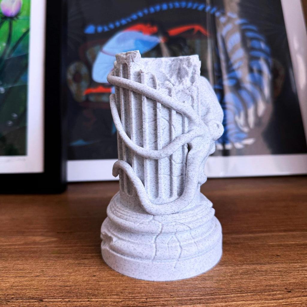 A propagation vase designed to look like a Greek Column with an Octopus wrapped around it